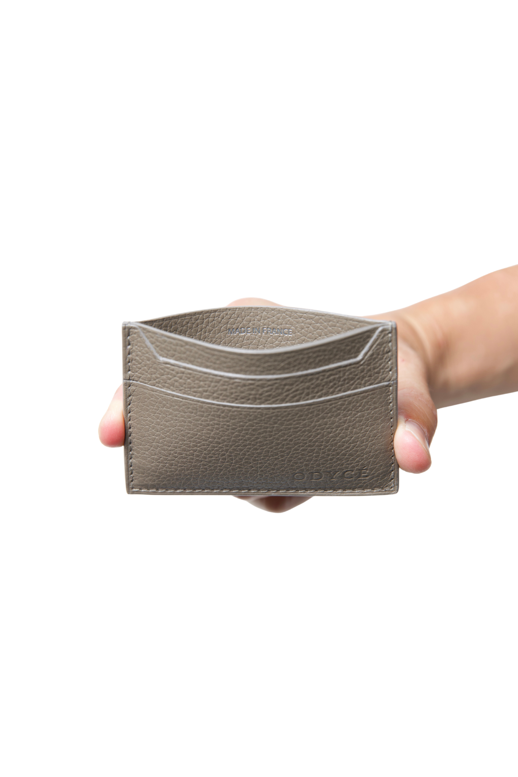 ODYCÉ Kartenhalter Taupe in der Hand